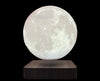 Floating moon lamp from outer space on a wooden base